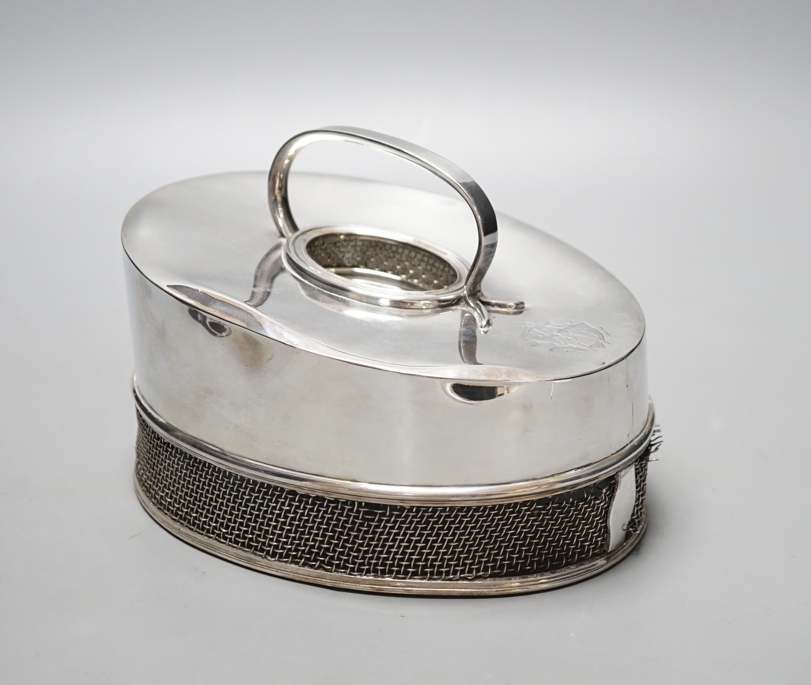 An unusual silver oval cheese dish cover, with mesh border, Martin, Hall & Co Ltd, Sheffield, 1921, 20.2cm, gross 21oz.